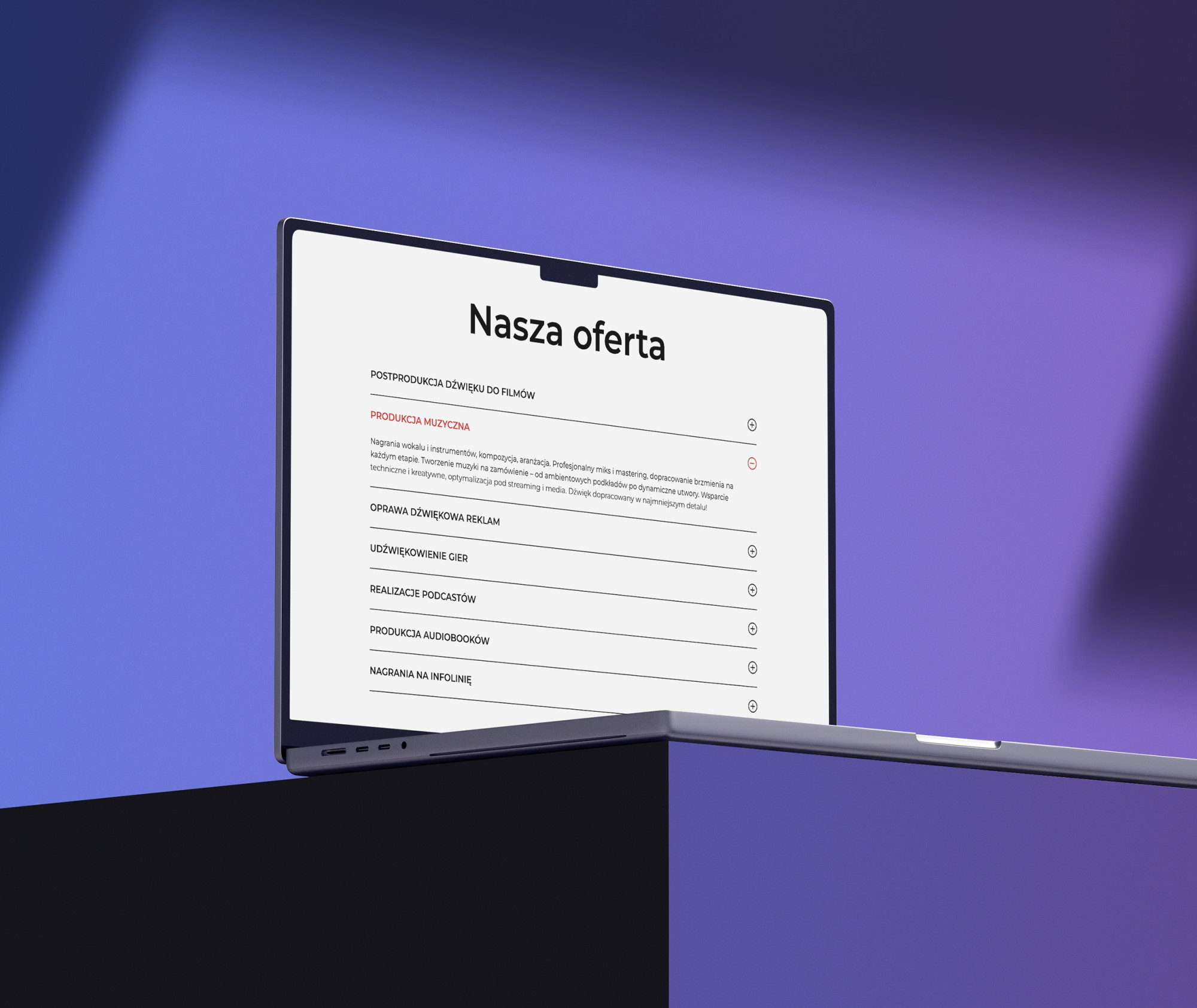 Laptop prezentujący zakładkę „Nasza oferta” ze szczegółowym opisem usług studia nagrań Mixownia.