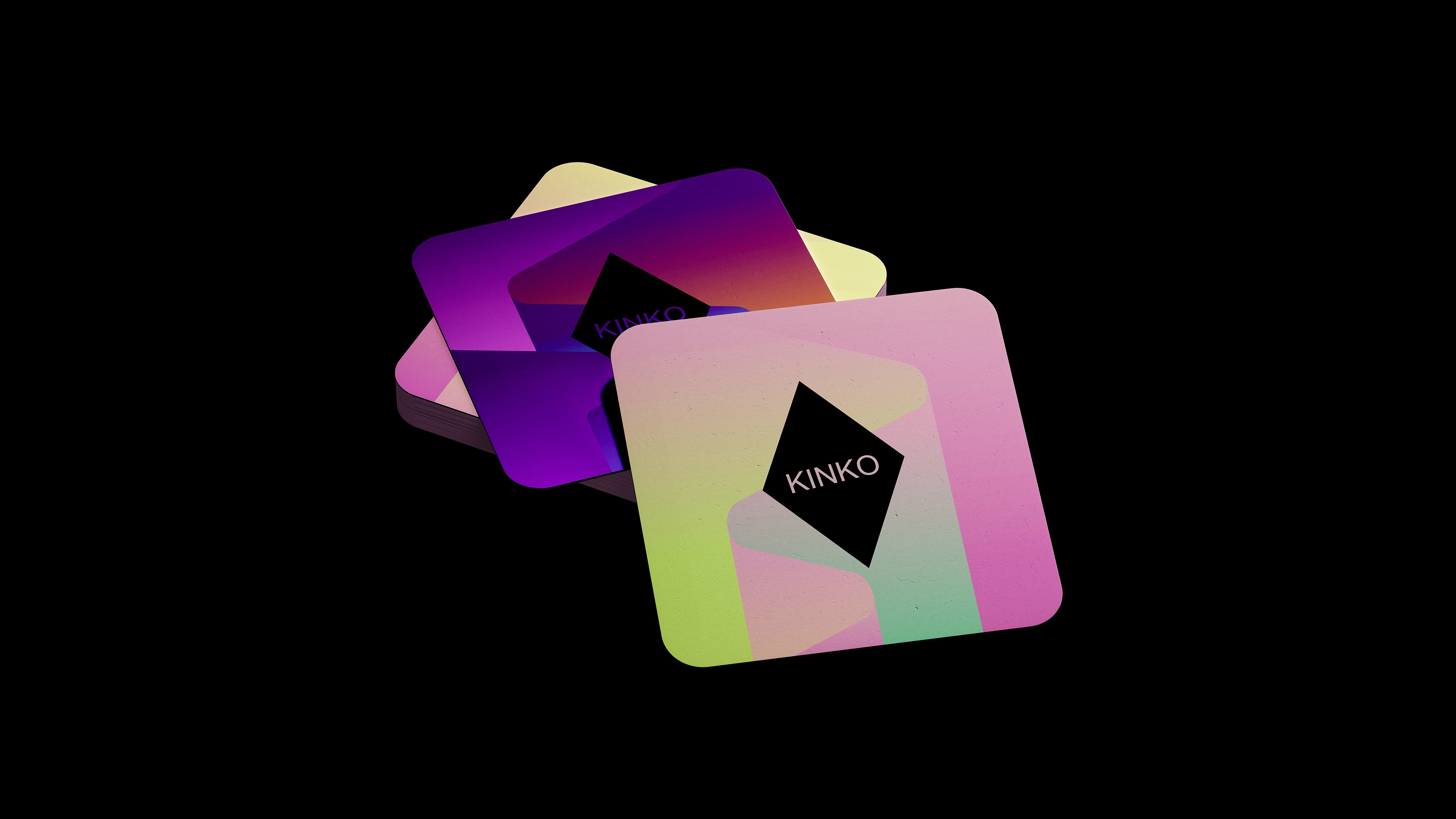 Podstawki pod piwo z identyfikacją KINKO Aurora w neonowej kolorystyce i geometrycznym sygnetem.